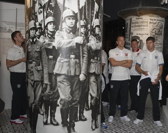 Day football came second: Rooney heads England delegation on emotional tour of harrowing Nazi concentration camp at Auschwitz