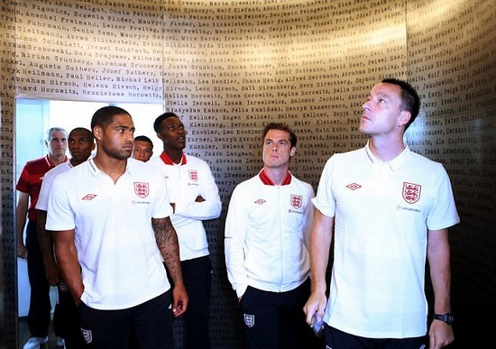 Day football came second: Rooney heads England delegation on emotional tour of harrowing Nazi concentration camp at Auschwitz