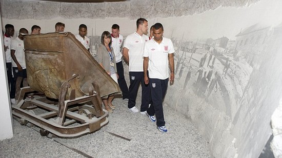 Day football came second: Rooney heads England delegation on emotional tour of harrowing Nazi concentration camp at Auschwitz