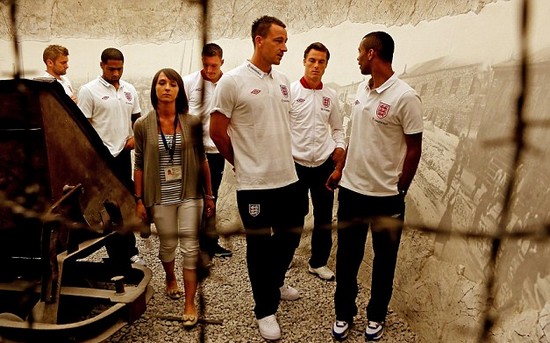 Day football came second: Rooney heads England delegation on emotional tour of harrowing Nazi concentration camp at Auschwitz