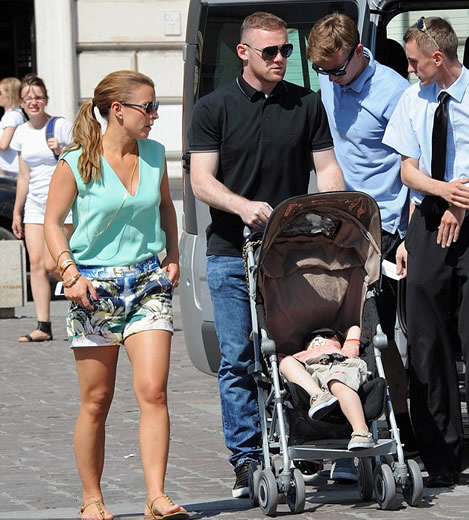 Happy Father's Day! Wayne Rooney takes a break from football at Euro 2012 to enjoy some family time with Coleen and son Kai
