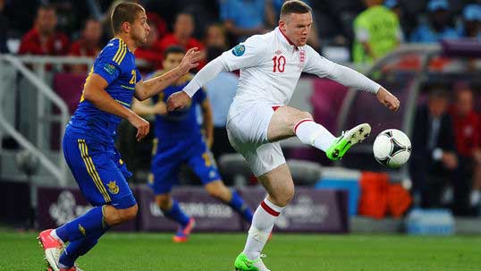 Returning Rooney fires England top