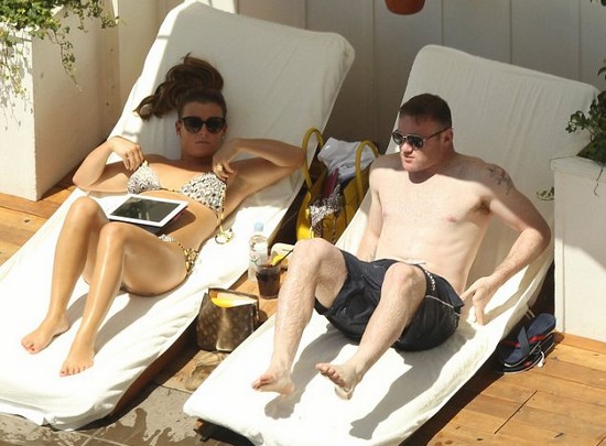 Distracting themselves from the football! Wayne and Coleen Rooney enjoy tour of LA sights during Euro 2012 semi final match