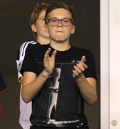 Brooklyn Beckham looks good in specs from mum's collection