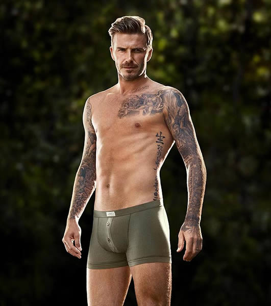 David Beckham shows off his bulging ... muscles