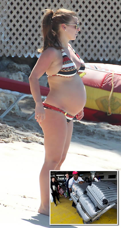 Not travelling light: Coleen in just a bikini – but what’s in all that luggage, then?