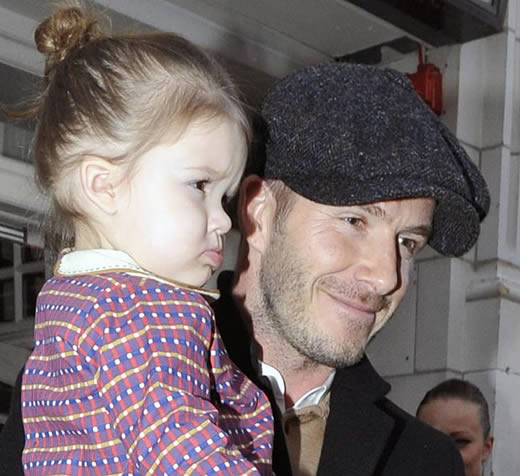 As Posh glams it up at Fashion Week, dressed down David takes his Beckham brood for a kick-about