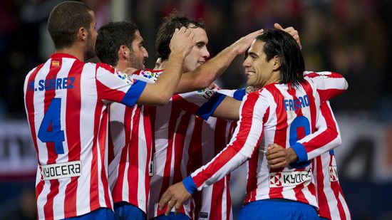 Atletico down Celta to seal top-three finish