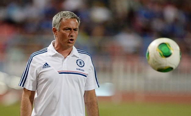 Mourinho tastes victory in first match back with Chelsea... but no wonder he looks a bit confused with those names and numbers!