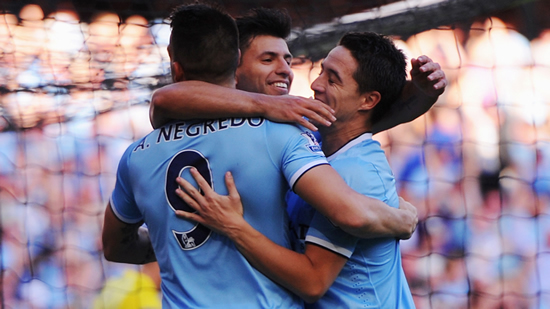 Aguero shares credit for City rout