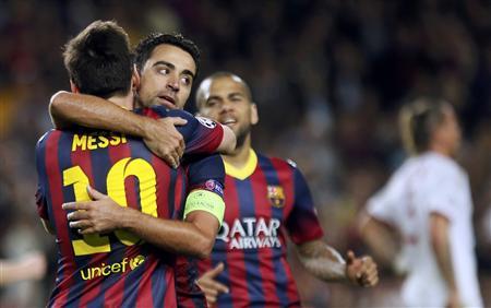 Messi magic returns to put Barca through