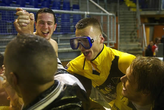 NAC Breda players celebrate win in pitchside jacuzzi with fans