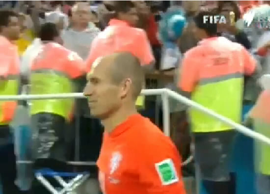 Cute: Arjen Robben consoles crying son with his wife after Holland lose on penalties to Argentina