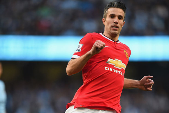 Manchester United striker Robin van Persie has a kickabout with fans