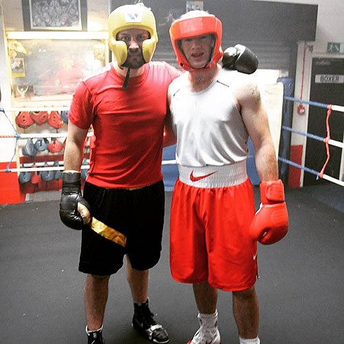 Man Utd captain Wayne Rooney puts his boxing gloves on