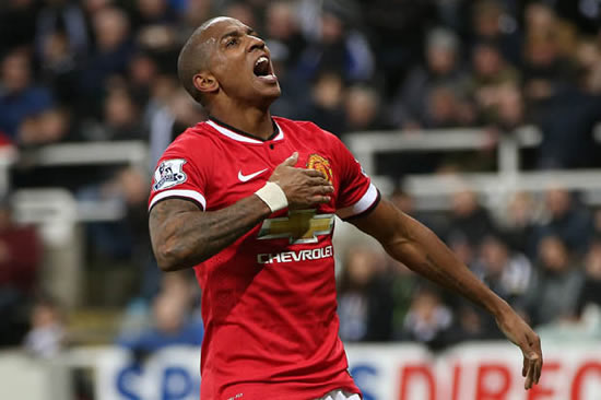 Man United player and good samaritan Ashley Young helps out Man City fan