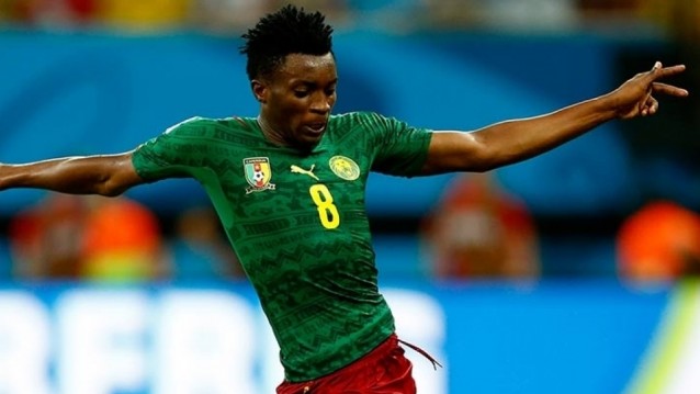 Cameroon battle past Thailand