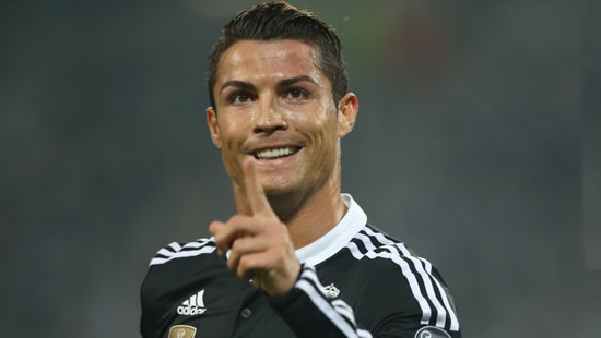 Cristiano Ronaldo celebrates scoring a diving header in training