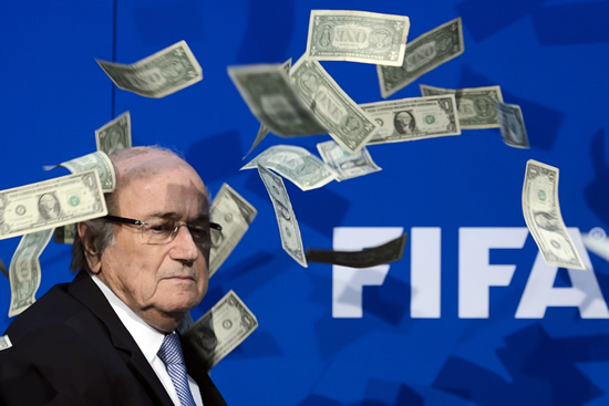 UK prankster Simon Brodkin throws money at Fifa's Sepp Blatter