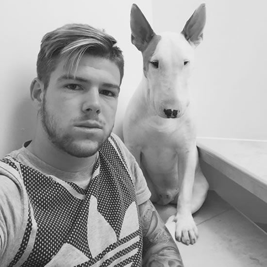 Liverpool star Alberto Moreno relaxes with his pet dog