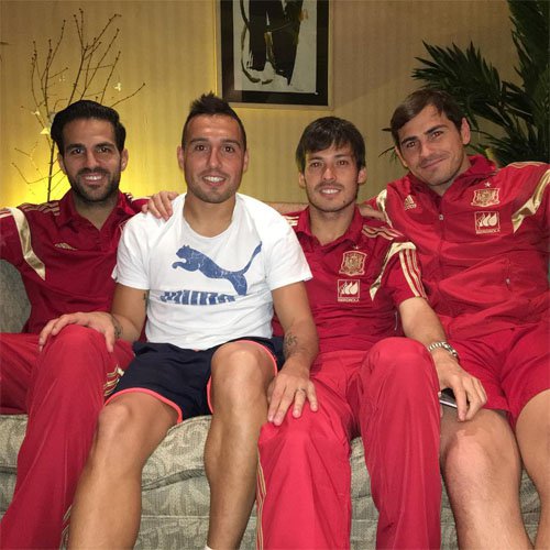 Chelsea star Cesc Fabregas poses with Arsenal midfielder