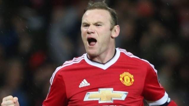 Rooney penalty sends United through
