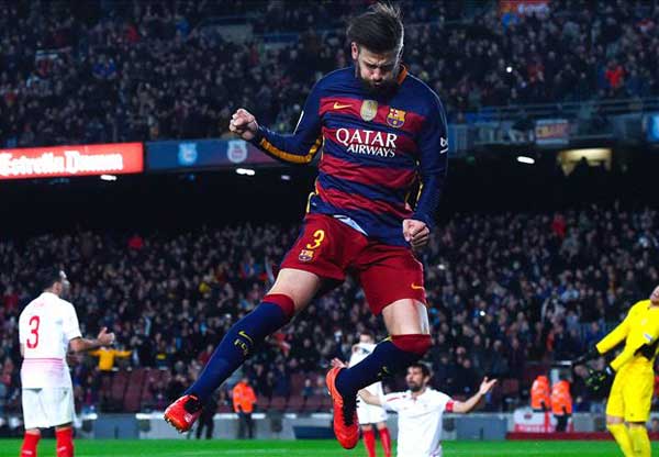 Barcelona 2-1 Sevilla: Pique sends champions eight points clear