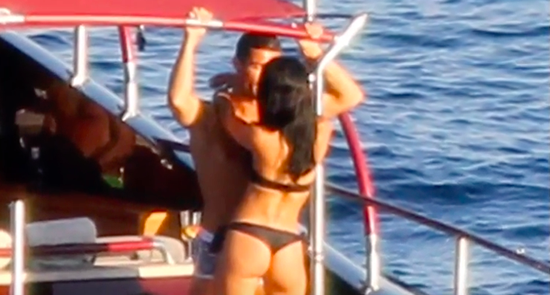 Cristiano Ronaldo parties with a pretty brunette on a boat in Ibiza