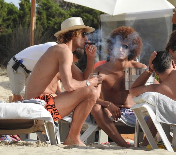 HAVANA LAUGH Marouane Fellaini smoking: Manchester United midfielder pictured smoking a cigar while on holiday in Ibiza