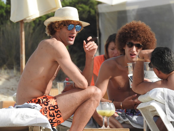 HAVANA LAUGH Marouane Fellaini smoking: Manchester United midfielder pictured smoking a cigar while on holiday in Ibiza