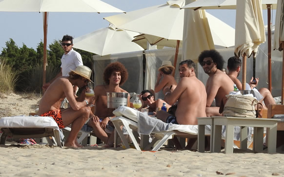 HAVANA LAUGH Marouane Fellaini smoking: Manchester United midfielder pictured smoking a cigar while on holiday in Ibiza