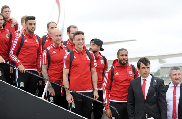 HOME SWEET HOME Welsh soccer heroes touchdown to massive welcome on return to Cardiff