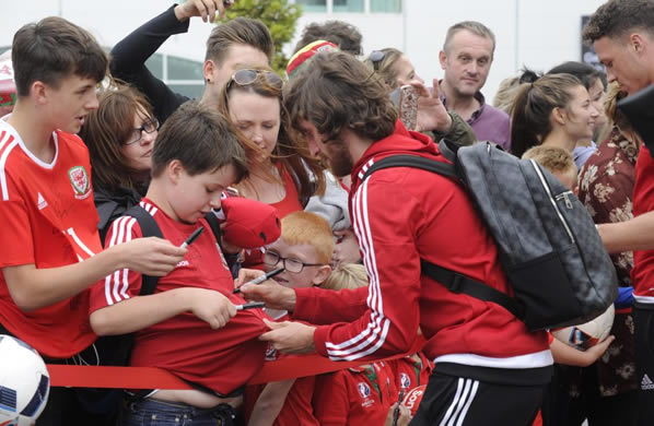 HOME SWEET HOME Welsh soccer heroes touchdown to massive welcome on return to Cardiff