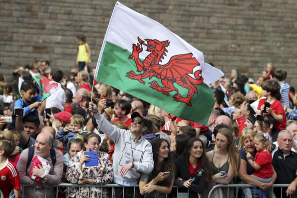 HOME SWEET HOME Welsh soccer heroes touchdown to massive welcome on return to Cardiff