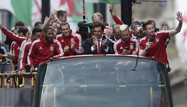 HOME SWEET HOME Welsh soccer heroes touchdown to massive welcome on return to Cardiff