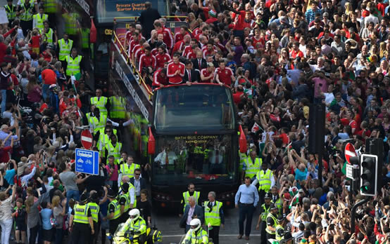 HOME SWEET HOME Welsh soccer heroes touchdown to massive welcome on return to Cardiff