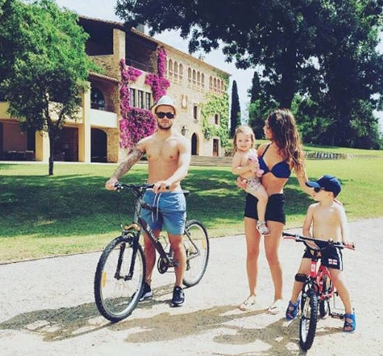 Arsenal midfielder Jack Wilshere in topless holiday bike ride with gorgeous WAG