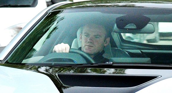 Manchester United captain Wayne Rooney arrives to training in style driving a BMW worth over £100,000