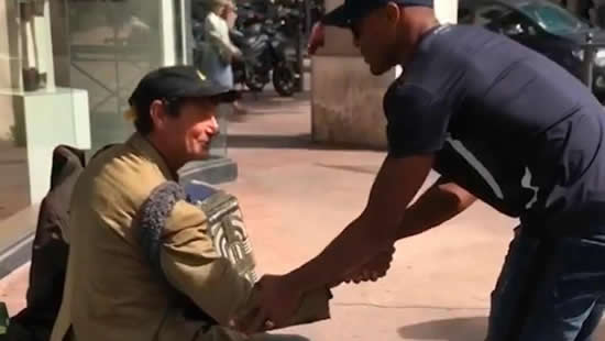 Ex-Manchester United legend Patrice Evra takes time off training to hand out food to the homeless