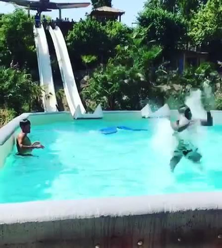 Mario Balotelli almost smashes his head on side of swimming pool as Nice star flies off end of slide