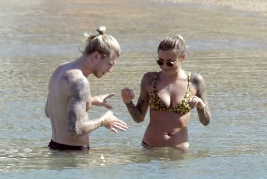 LIFE'S A BEACH Loris Karius suns himself on beach with stunning girlfriend as blunder keeper turns down chance to watch Liverpool in Champions League final