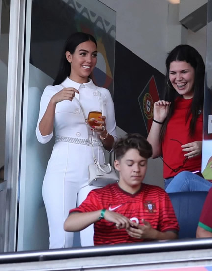 Georgina Rodriguez drinks wine and stuns in white jumpsuit as she cheers Cristiano Ronaldo onto latest trophy win