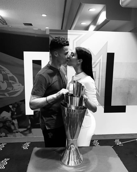Georgina Rodriguez drinks wine and stuns in white jumpsuit as she cheers Cristiano Ronaldo onto latest trophy win