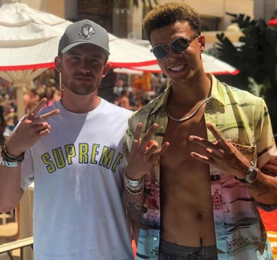 Dele Alli chats to mystery woman after being driven around LA in convoy of supercars as Spurs ace enjoys well-deserved break