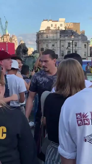 Watch Zlatan Ibrahimovic lookalike fall into Trafalgar Square fountain during cricket World Cup celebrations as he takes on fellow reveller