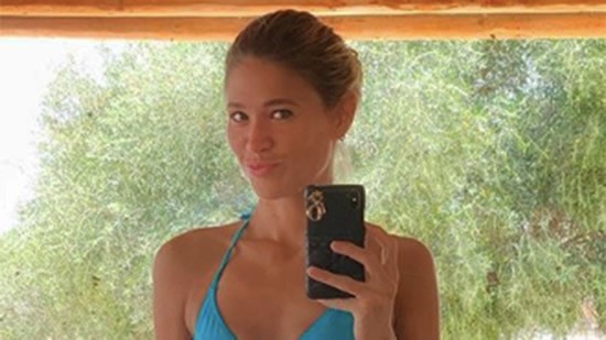 Simeone's wife Carla Pereyra criticised for bikini photo