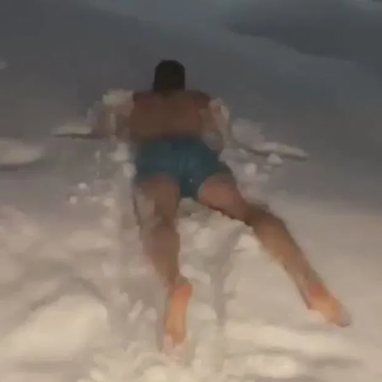 Spurs star Harry Kane dive face first into a snow drift wearing only his shorts on trip to Santa's home in Finland