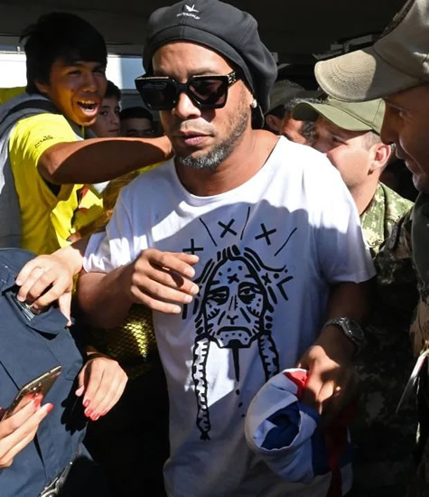 BRAZIL LEGEND QUIZZED Football star Ronaldinho probed in Paraguay after police raid on hotel after ‘being found with fake passports’