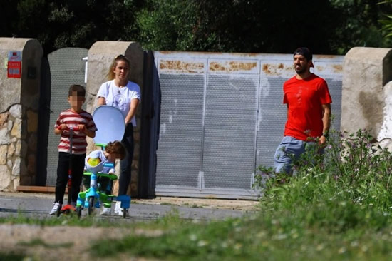 Luis Suarez seen for first time in six weeks during walk with family as Barcelona 'put striker on transfer list'
