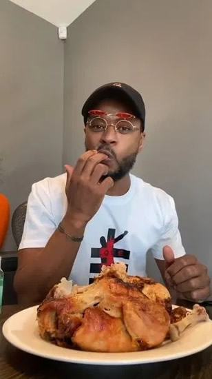 PROFESSIONAL FOWL Watch Patrice Evra eat cooked chicken in bizarre ‘upgrade’ to infamous video of Man Utd legend licking RAW meat